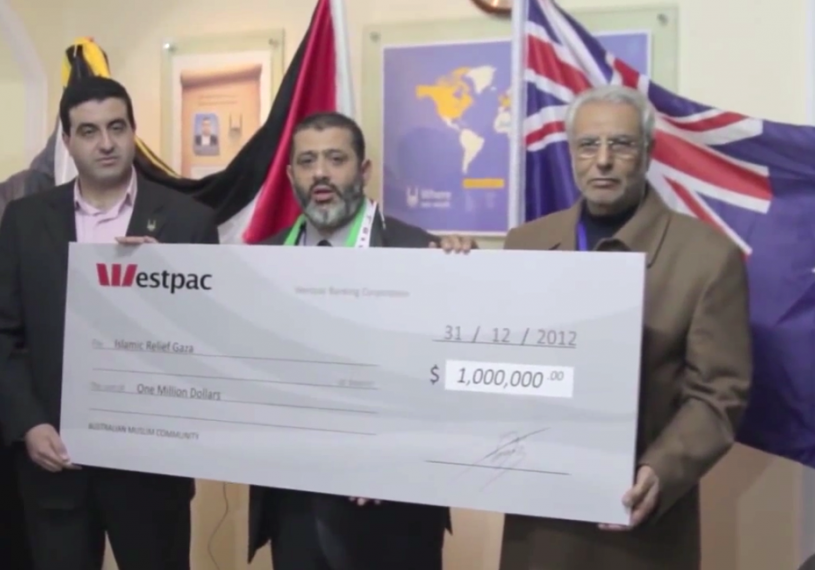 Islamic Relief Australia delegation in Gaza presenting a cheque for $1 million to Islamic Relief Gaza (YouTube screenshot)