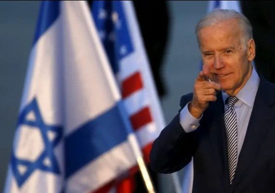 Then US Vice President Joe Biden gestures after disembarking from a plane upon landing at Ben Gurion International Airport in Lod, near Tel Aviv, Israel March 8, 2016 (photo credit: REUTERS/BAZ RATNER)