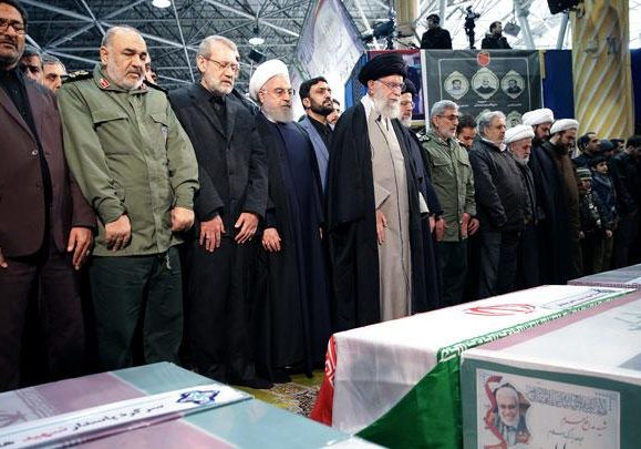 Iran's Supreme Leader Ayatollah Ali Khamenei leads prayers near the coffins of Iranian Major-General Qassem Soleimani, head of the elite Quds Force, and Iraqi militia commander Abu Mahdi al-Muhandis (Official President's Website/Handout via REUTERS)