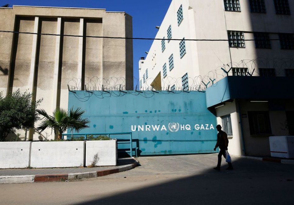 A Palestinian man walks past the building of the UNRWA headquarters in Gaza City on January 8, 2018.
(Photo MOHAMMED ABED/AFP/Getty Images)