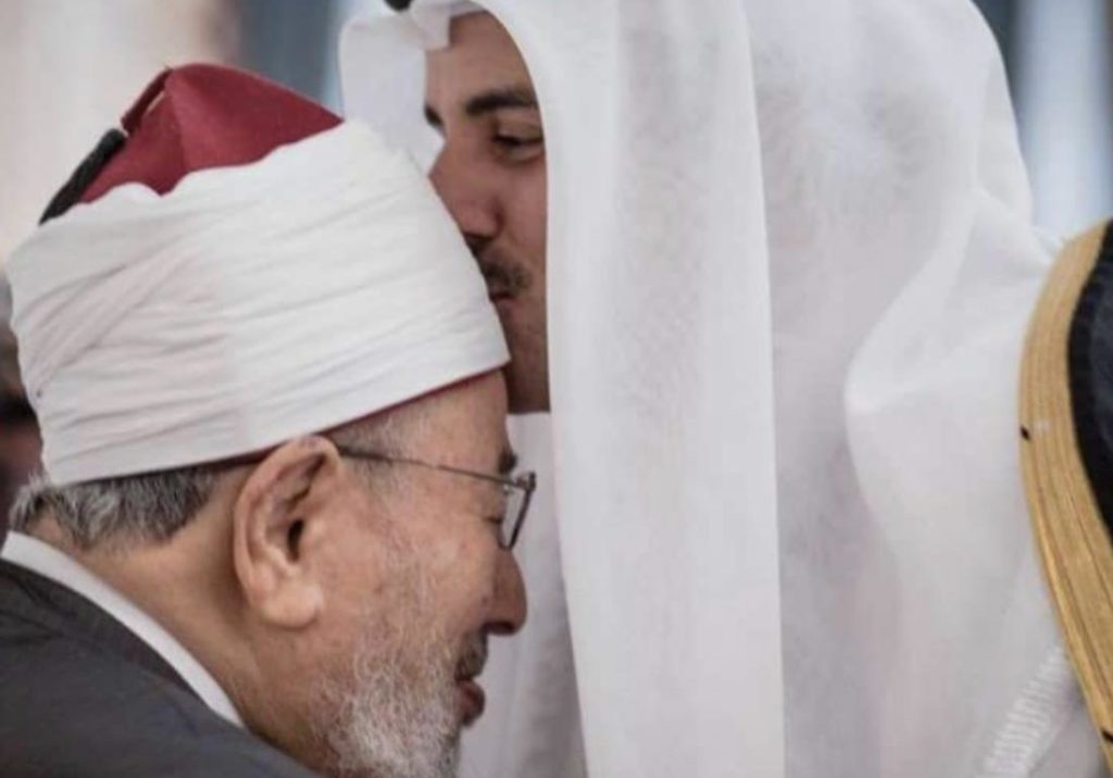 Qatari Emir Sheikh Tamim bin Hamad Al-Thani (Right) kisses Yusuf Al-Qaradawi, an extremist Al-Jazeera host and "spiritual leader" for Hamas and the Muslim Brotherhood