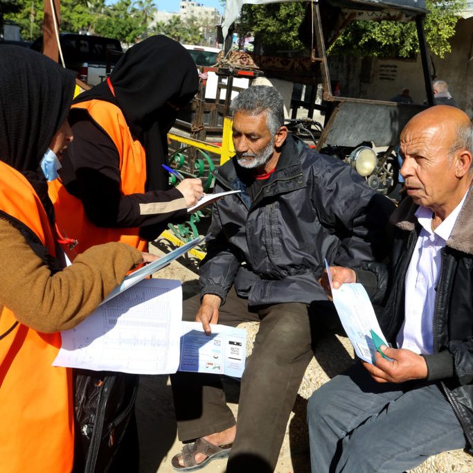 Palestinian employees of the Central Elections Committee in the Gaza Strip work to educate and register citizens in preparation for parliamentary and presidential elections (Credit: Shutterstock)