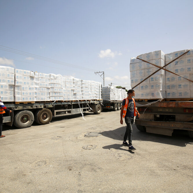 Aid trucks crossing into Gaza in May 2021 (image: Shutterstock/Anas-Mohammed)