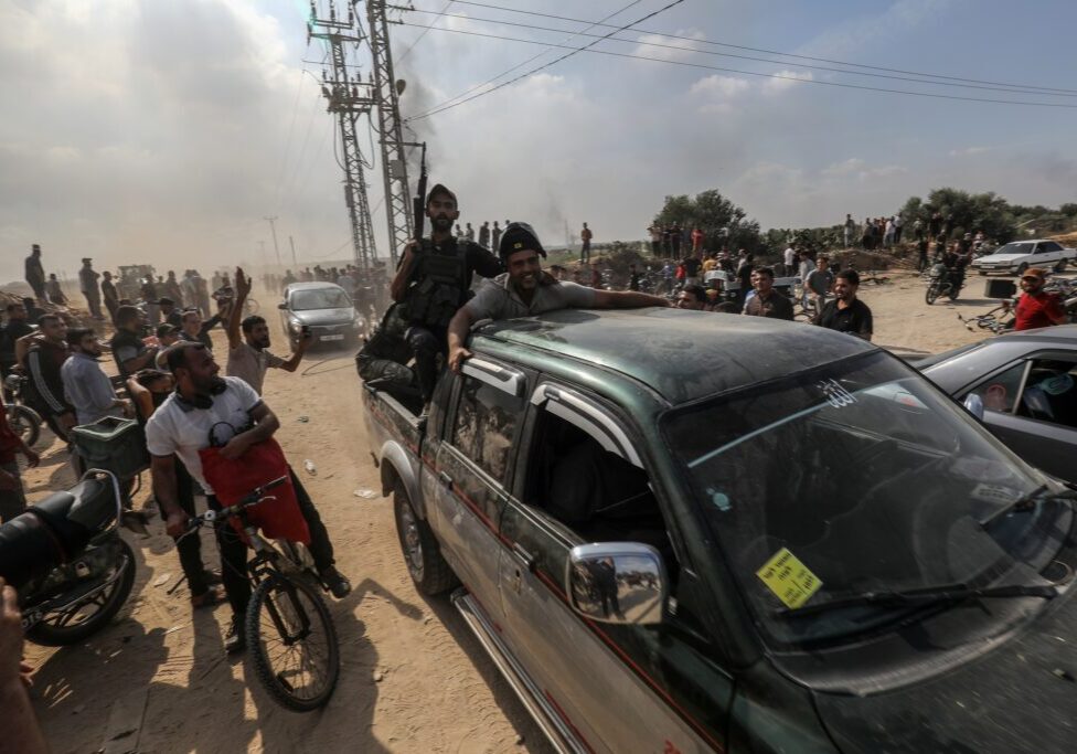 Palestinians storm across the Gaza border, 7 October 2023 (Image: Shutterstock)