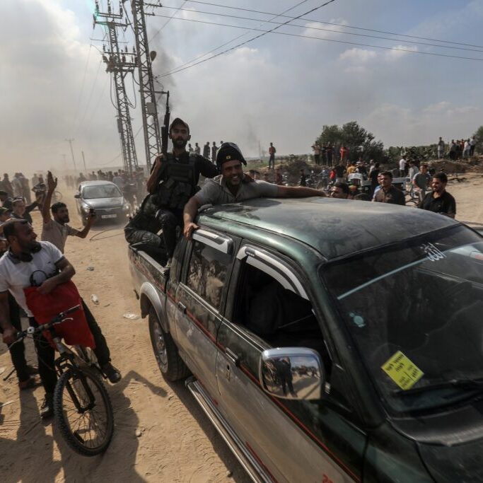 Palestinians storm across the Gaza border, 7 October 2023 (Image: Shutterstock)