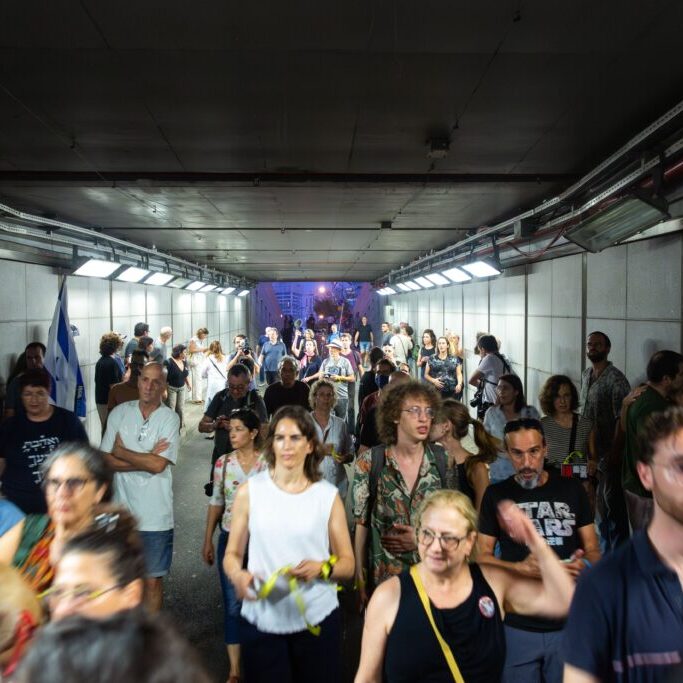 Israeli civilians rushing into public shelters as the sirens go off during the ongoing Hamas-Israel war (Image: Shutterstock)