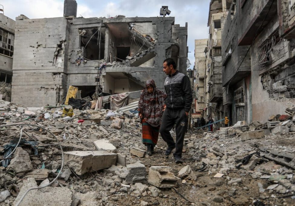 Palestinians inspect their destroyed house after an Israeli air strike in the city of Rafah in the southern Gaza Strip (Image: Anas Mohammed/ Shutterstock)