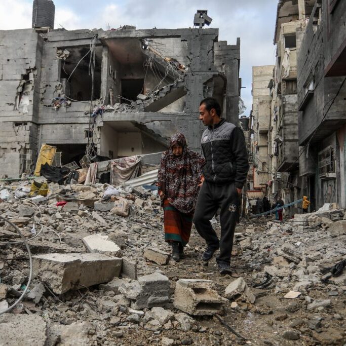 Palestinians inspect their destroyed house after an Israeli air strike in the city of Rafah in the southern Gaza Strip (Image: Anas Mohammed/ Shutterstock)