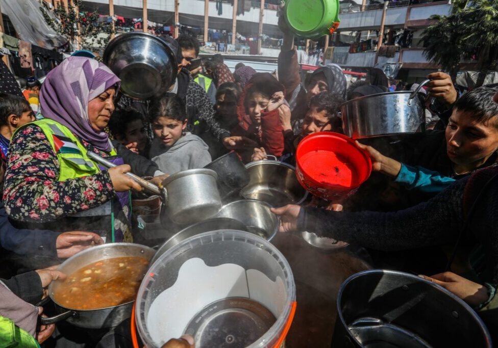 Palestinian charitable organisations distribute food “takiya” to displaced people in the city of Rafah (Image: Shutterstock)
