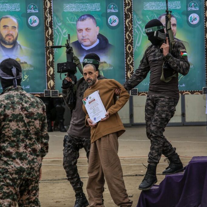 Israeli hostage Eli Sharabi during his handover by Al-Qassam Brigades to the Red Cross, in Deir al-Balah, central Gaza Strip, on February 8, 2025 (Image: Anas Mohammed/ Shutterstock)