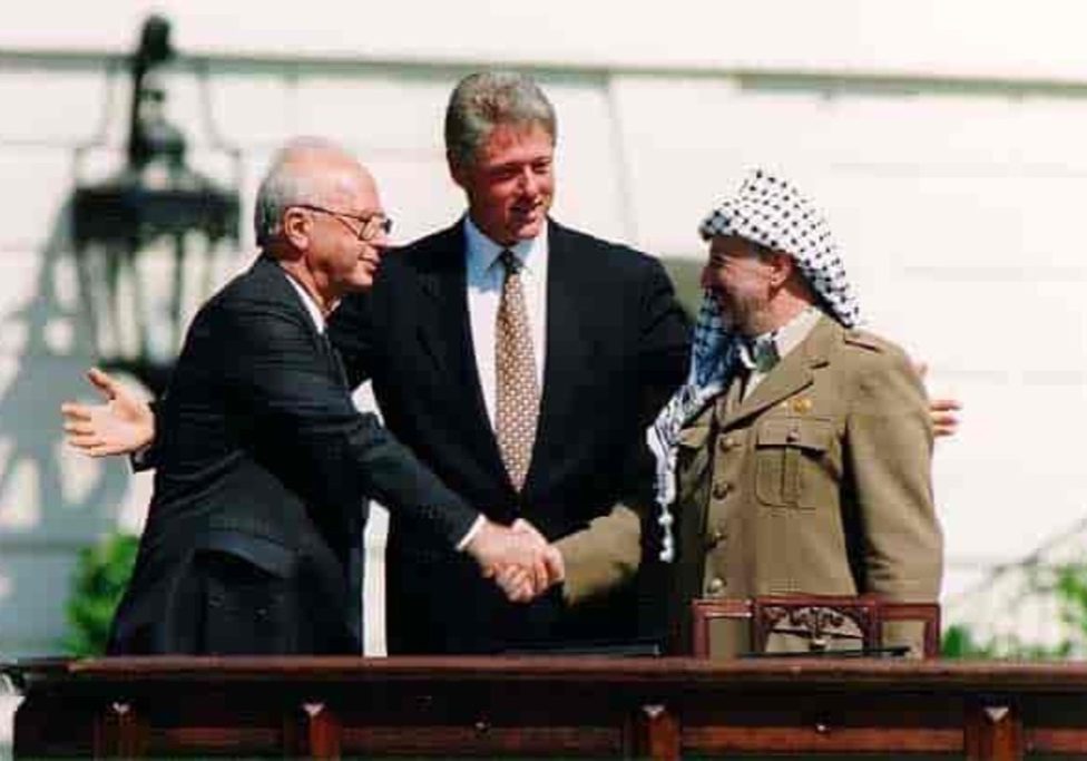 Oslo Accords signing ceremony in 1993 with then Prime Minister Yitzhak Rabin (left), then US President Bill Clinton and former PLO leader Yasser Arafat
