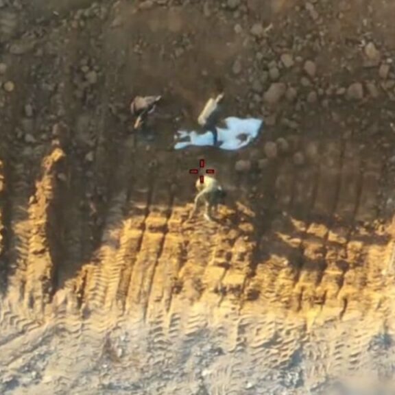 Israeli military drone video shows Hamas operatives burying a white shroud containing hostage remains in Gaza City and then staging its discovery in front of the Red Cross (IDF video screenshot)
