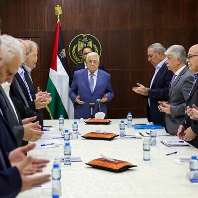 Wafa E1719317595956 640x400 Palestinian Authority President Mahmoud Abbas (C) recites a prayer during a meeting with members of the executive committee of the Palestine Liberation Organisation (PLO) in the West Bank city of Ramallah (Image: WFA/ X)